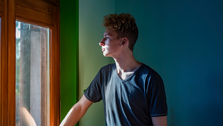 This image is a stock pic to show someone reflecting on homelessness