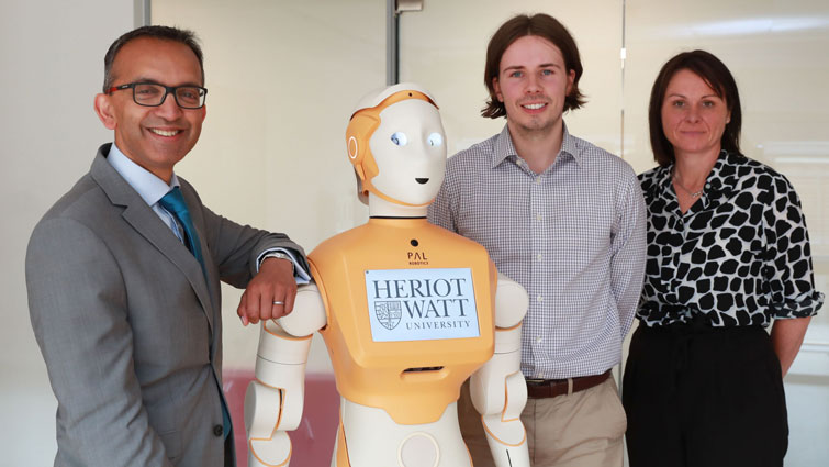 Professor Soumen Sengupta, Chief Officer of South Lanarkshire University HSCP, with ARI, PhD student Carl Bettosi and Claire Rae, Head of Health and Social Care for the HSCP
