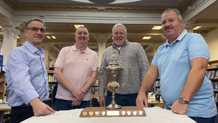 Friends reunited by lost football trophy