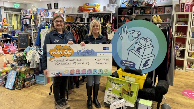This image shows some of the team from Waist Not Want Not after receiving a financial donation for the Community Wish List