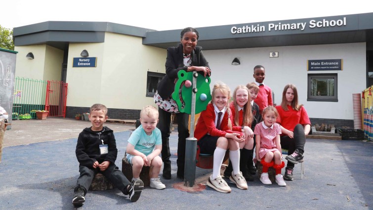 Noreen Black, Head Teacher with children from all year groups