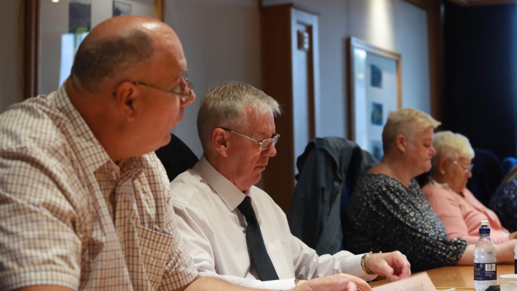 This image shows tenant representatives at a meeting