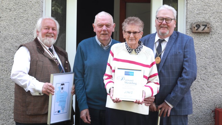 This image shows Mr and Mrs Gebbie celebrating their Diamond Wedding Anniversary with Depute Provost Bert Thompson and Deputy Lieutenant for Lanarkshire Alexander Wilkie MBE