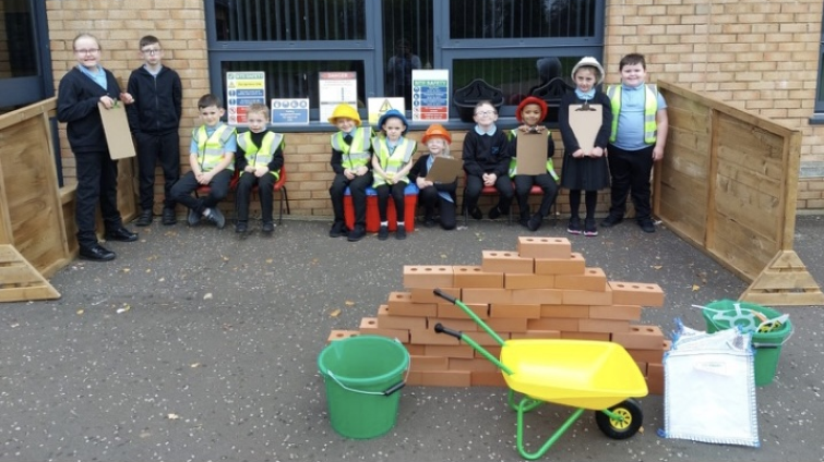 primary pupils outside in play area