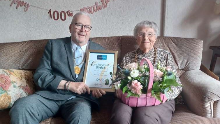 This image shows Depute Provost Bert Thomson with Joyce Davies who is celebrating her 100th birthday