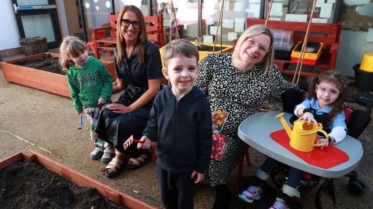 This image shows Councillor Lynsey Hamilton with Debbie Shaw and young people from the Early Learning Unit in Hamilton