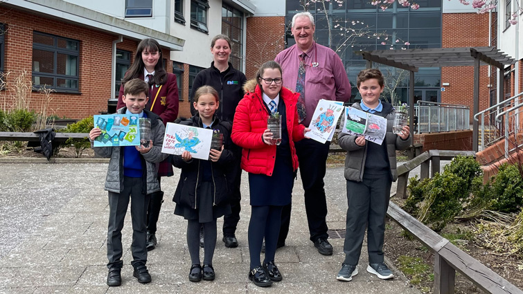 eco poster winners being awarded their certificates by Climate Action Strathaven and Strathaven Academy Eco Committee