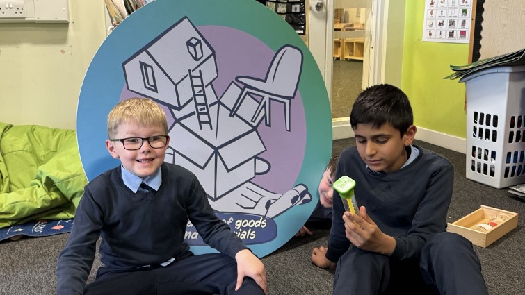 Two pupils are sitting in the sensory room with the new equipment.