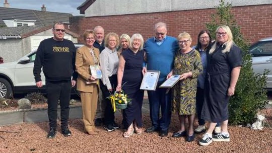 Maureen and George Hutchinson and family with Provost Margaret Cooper and Deputy Lieutenant for Lanarkshire Linda McDowall