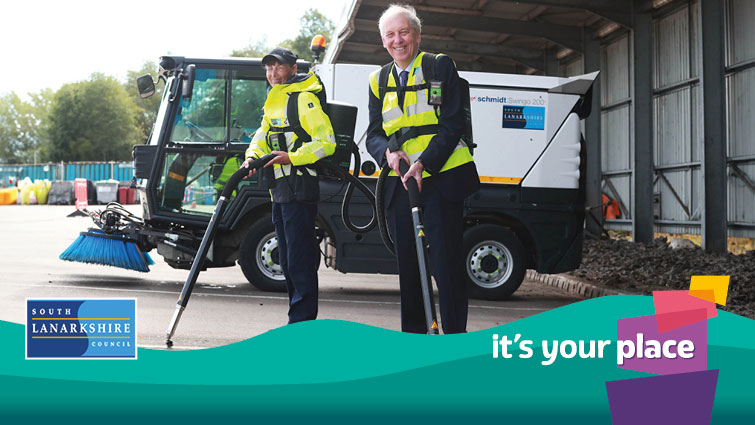 It's your place campaign - Councillor Robert Brown and litter picker Sharon Montgomery with the chewing gum machines on their backs