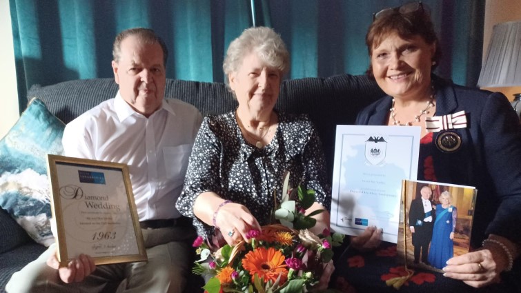 This image shows Mr and Mrs Yardley with DLL Alison Plummer on their 60th wedding anniversary