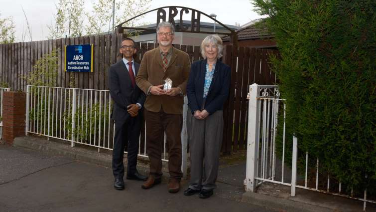 This image shows Professor Soumen Sengupta, Ramon Hutchingson and Councillor Margaret Walker outside the Autism Resources Coordination Hub base with the award Ramon won
