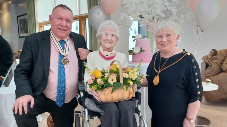 This photo shows Provost Margaret Cooper and DL David Russell celebrating Margaret McDade's 104th birthday 