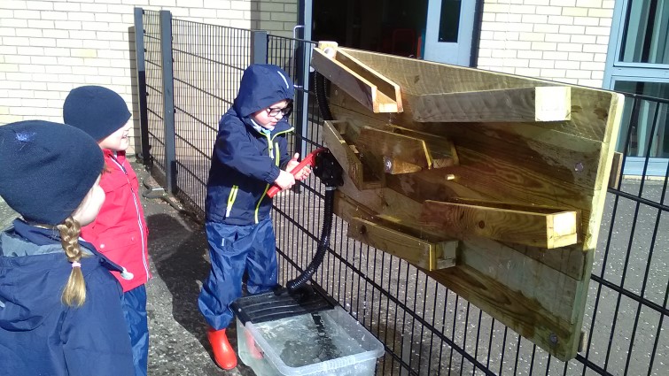 primary school pupils outside in playground