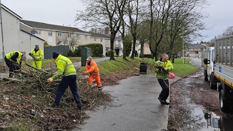 grounds team clearing away fallen trees