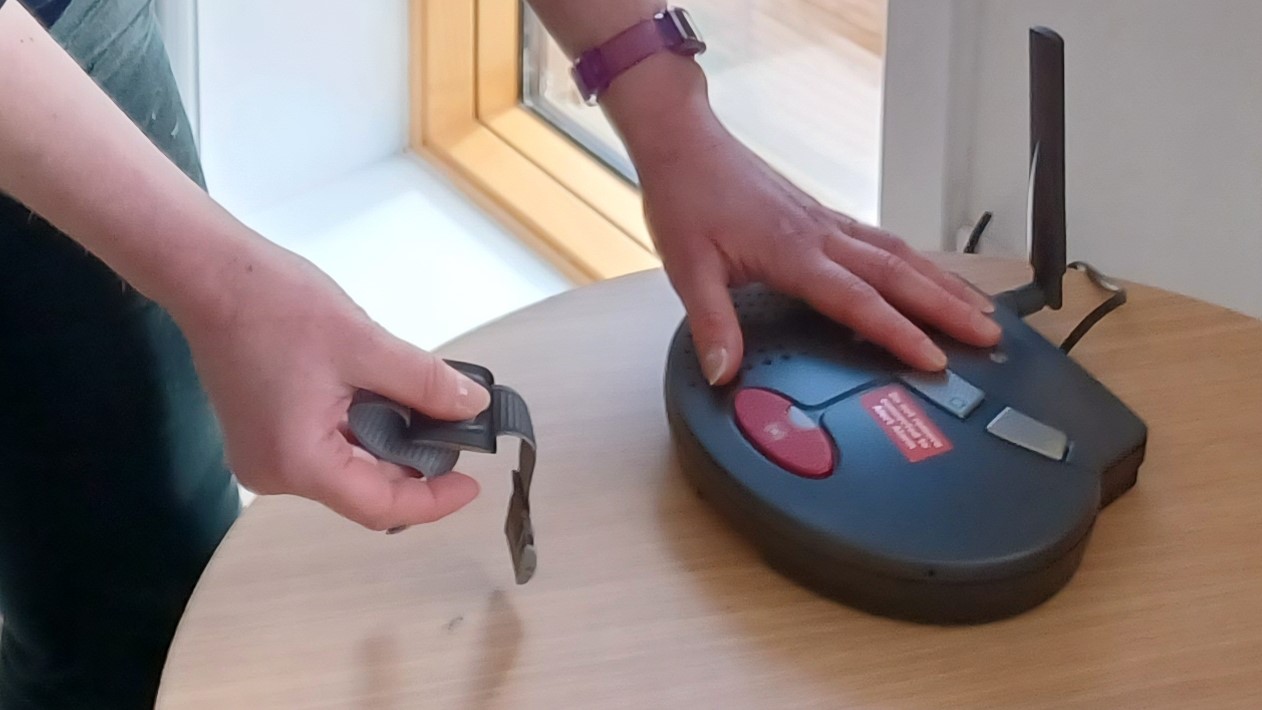 A community alarm being installed