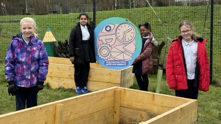 Children from Neilsland Primary School, Hamilton, with their new planting beds. 