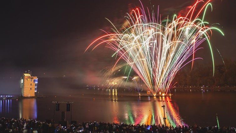 This is a photo of fireworks in the sky over the Strathclyde Park loch.