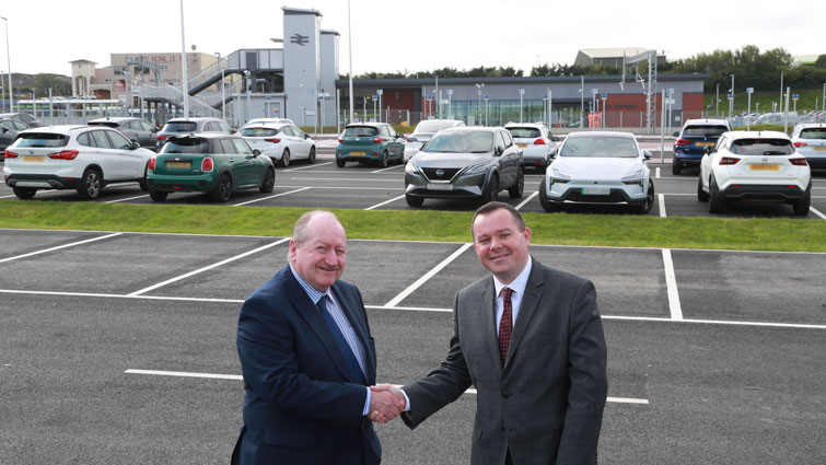 This image shows council leader Joe Fagan and chair of SPT Stephen Dornan at the new park and ride at Hairmyres railway station