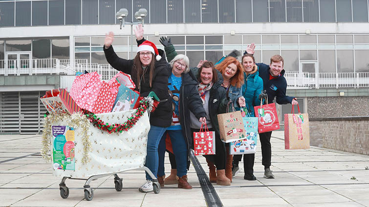 This image shows staff who have helped co-ordinate gifts and food for local foodbanks in the run up to Christmas 2022 