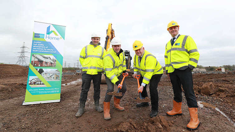 This image shows Councillor Davie McLachlan, Exec Director Stephen Gibson and reps from Taylor Wimpey at a sod cutting ceremony 