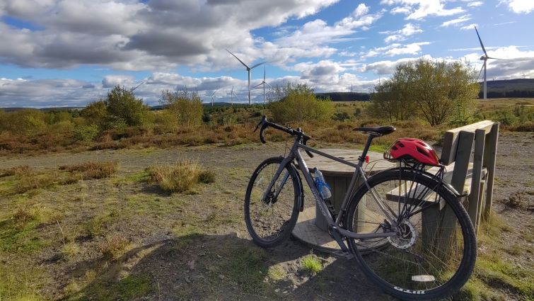 A view over the Douglas Valley with a bicycle in the foreground.