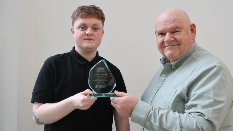 This image shows Apprentice of the Year, Connor Murphy, holding his award with Chair of the council&rsquo;s Housing and Technical Resources Committee, Councillor Davie McLachlan