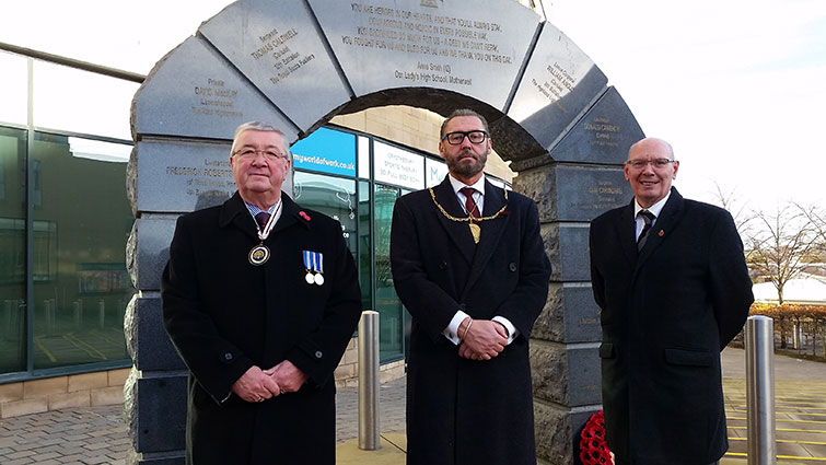 Deputy Lord Lieutenant of Lanarkshire Louis Munn, South Lanarkshire Provost Ian McAllan and South Lanarkshire Council Chief Executive Clelland Sneddon join veterans at the VC Memorial in Hamilton's New Town Square for the Armistice Day Service, 2021. 
