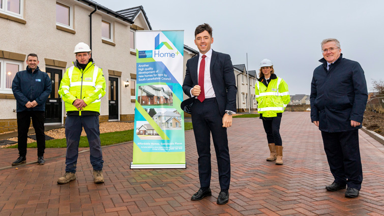 This images shows reps from South Lanarkshire Council and Taylor Wimpey as homes are handed over to the council for renting 