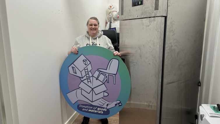 This image shows a member of Abington Community Development Group with a freezer donated through the community wish list