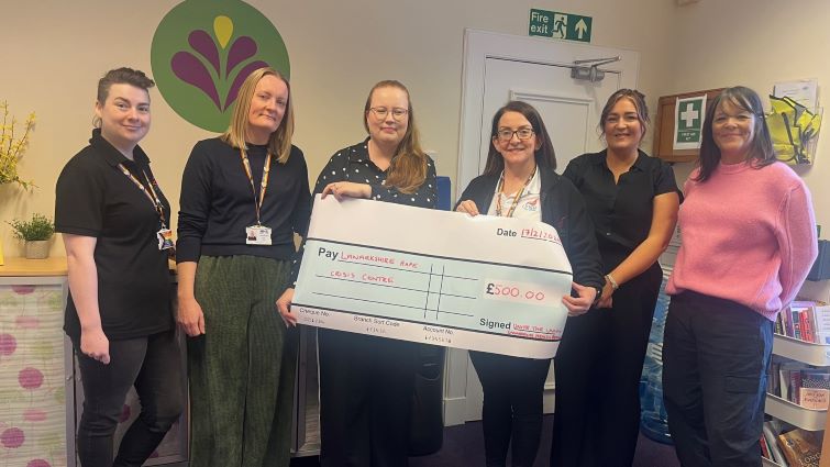 This image shows representatives from Lanarkshire Rape Crisis Centre and Unite the Union after the union made a donation through the Community Wish List