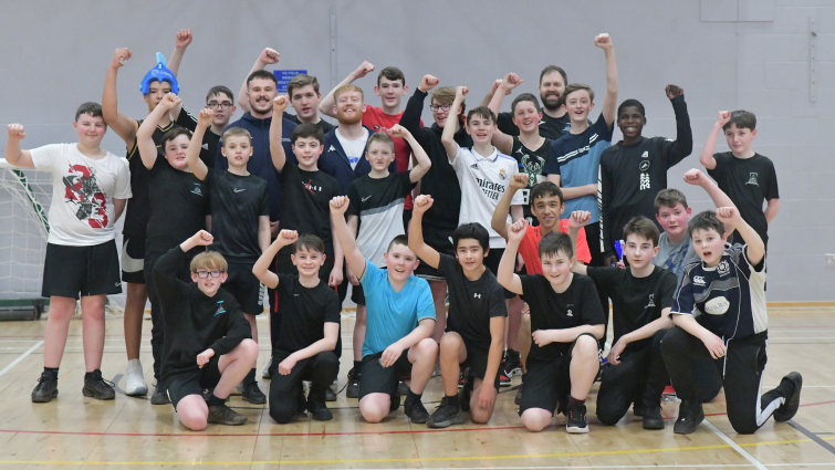This image shows players from Caledonian Gladiators basketball team who visited Duncanrig Secondary School ahead of their cup final this weekend