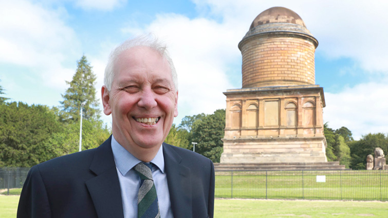 This image shows Councillor Robert Brown at Hamilton Mausoleum following the completion of repair work 
