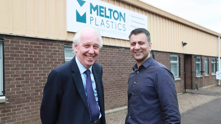 This image shows Melton Plastics owner Azam Khan with Councillor Robert Brown outsider the firm's premises in Carluke 