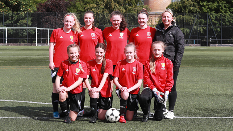 This image shows the girls' football team for the ICG 2022 