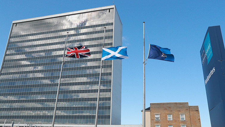 The Union Flag, Scottish Saltire and council flag flying at half-mast outside the council HQ.