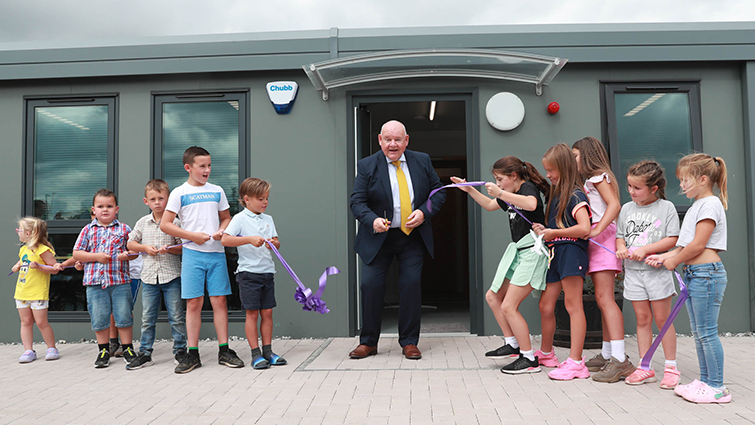 This image shows Councillor Davie McLachlan at the opening of a new community facility at Shawlands Crescent Gypsy/Traveller site in Larkhall