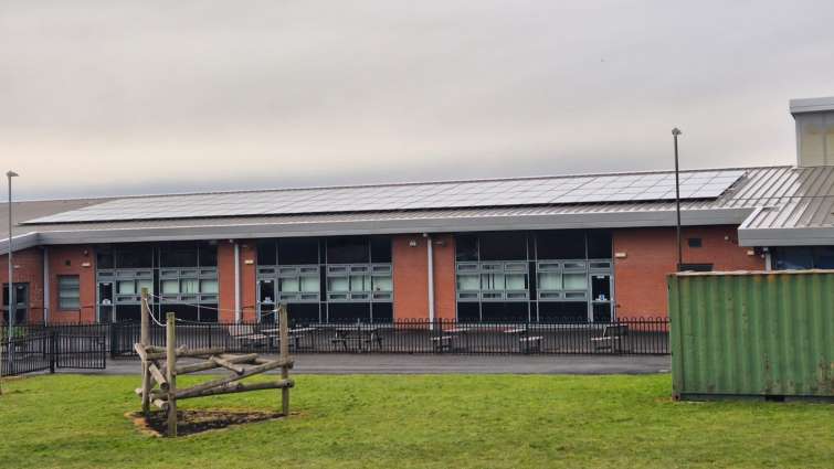 This is an exterior shot of Craigbank Primary school with photovoltaic panels on the roof