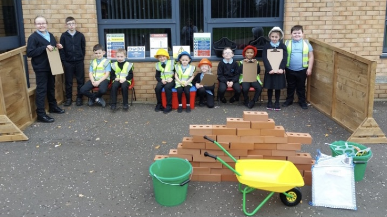 primary pupils outside in play area 