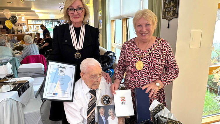 Provost Margaret Cooper and Deputy Lieutenant Mary Hernan congratulate Gordon Cowan on his 100th birthday 