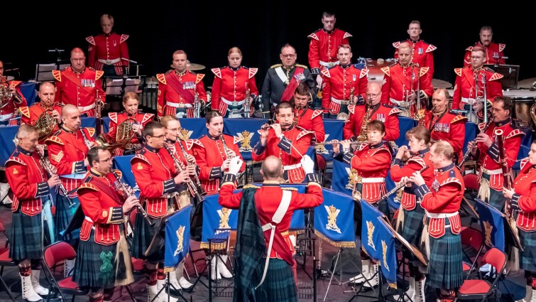 This image shows the band of the Royal Regiment of Scotland in performance 