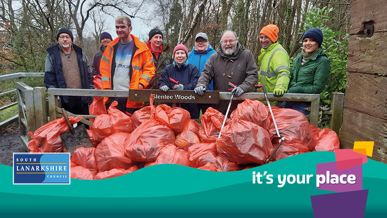 volunteer litter pickers and bags of rubbish 
