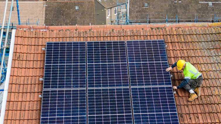 solar panels being installed on a roof