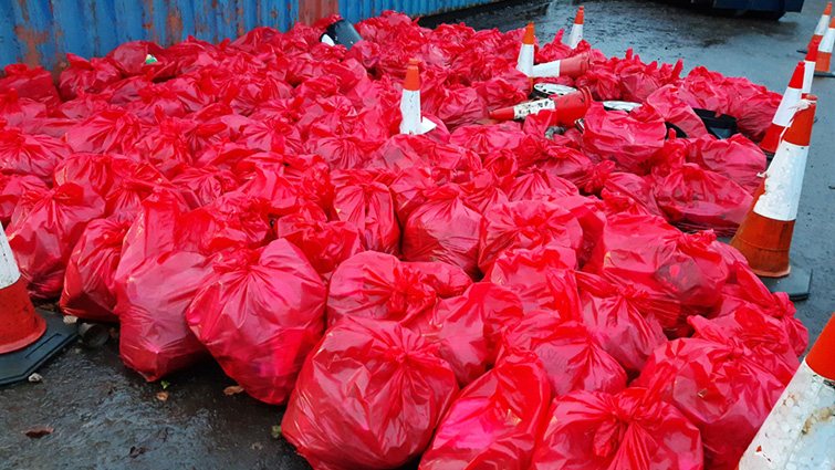 This photo shows a collection of more than 100 red bin bags full of litter collected during last week's clean-up.