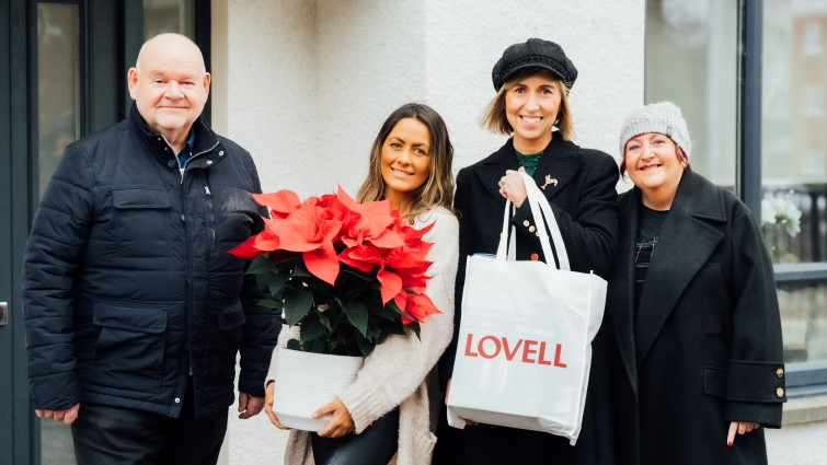 Councillor Davie McLachlan, Chair of the Council’s Housing and Technical Resources Committee at the Glow Garren development in Hamilton with a new tenant and Lovell and the council's Housing staff member 