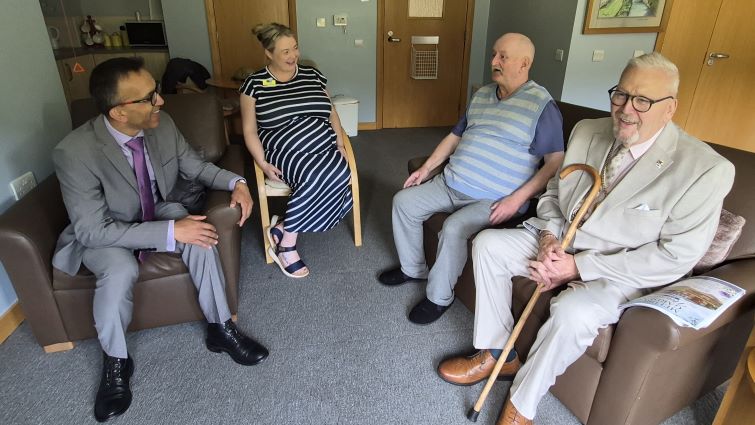 This image shows Provost Bert Thomson, Professor Soumen Sengupta, Laura McMillan and William Elliot during a visit to Meldrum Gardens in East Kilbride