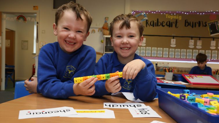 This image shows two pupils from Mount Cameron Primary School which offers Gaelic education in South Lanarkshire 