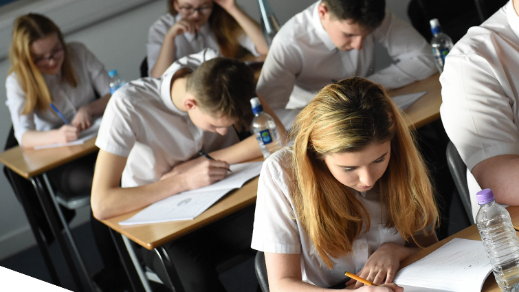 Pupils in a classroom studying for exams 