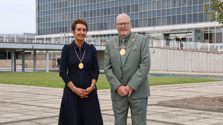 This image shows Provost Bert Thomson and Depute Provost Celine Handibode outside the council HQ in Hamilton