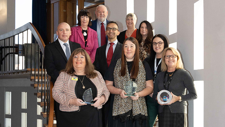 This image shows successful staff with councillors following three wins for the health and social care partnership at national award ceremonies